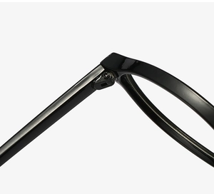 Close-up of durable metal hinge and sleek black frame of retro oval glasses