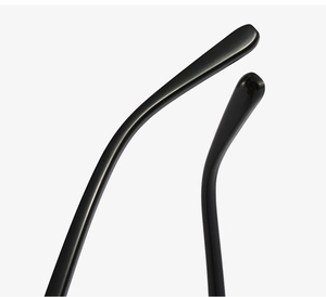 Close-up of glossy black eyeglass temple tips with polished curved ergonomic design