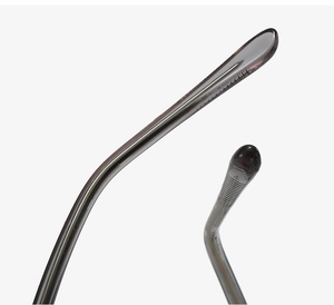 Macro detail of oval glasses temple tip with transparent gray finish and metal core