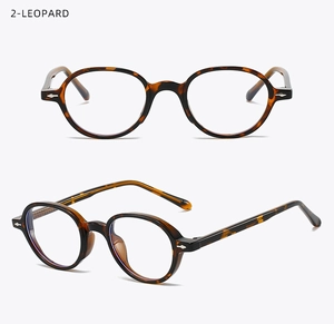 Detail view of retro oval leopard tortoiseshell frames with classic metal accents