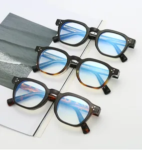 Detailed view of square blue light glasses with three-dot rivets on retro frames