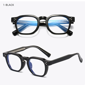 Detail of vintage thick square glasses frame with blue light blocking lenses and metal rivets