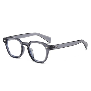 Retro grey translucent polygon sunglasses with silver diamond rivets from a 45-degree angle