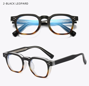 Detail of 2-BLACK LEOPARD glasses showing metal engraving and blue light lens coating