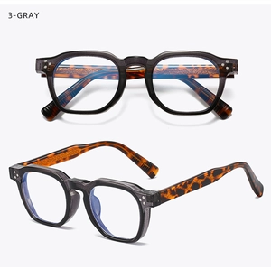 Macro view of gray retro square frames showing tortoiseshell temples and blue light lenses
