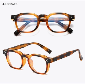 Detail of retro thick-frame glasses in leopard finish with triple metal rivets