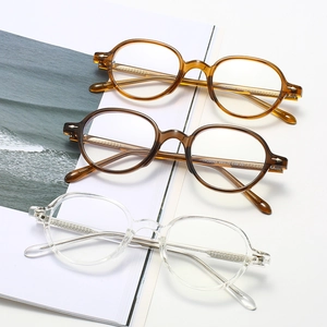 Retro oval anti-blue light glasses in amber, tortoiseshell, and transparent frames