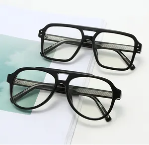 Close-up of black double-bridge pilot eyewear featuring detailed metal temple core