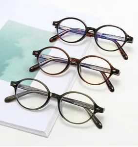 Three pairs of oval acetate glasses in tortoise shell, amber brown, and olive green