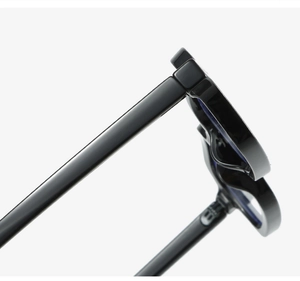 Macro shot of polished black square glasses hinge and sturdy temple design