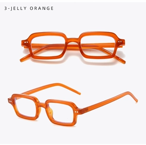 Detail view of jelly orange rectangle glasses frame with metal rivet accents