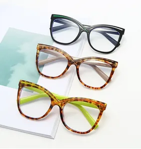 Three pairs of stylish cat-eye glasses in black, tortoiseshell, and green accents