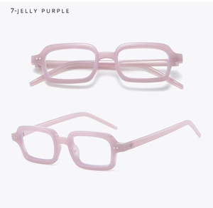 Detail view of jelly purple rectangular glasses frame with metallic dot accents