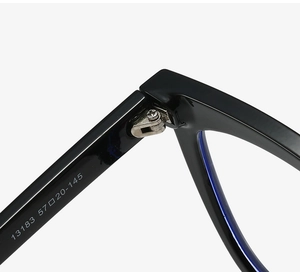 Detailed close-up of metal hinge and size specifications on cat-eye glasses frame