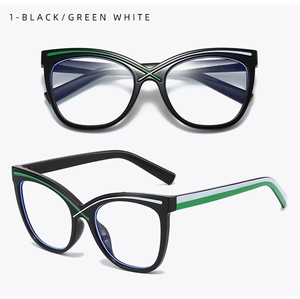 Close-up of cat-eye frames with black green and white stripes and size 5183 print