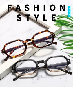 Close-up of polygonal blue light blocking glasses with tortoise and grey gradient frames