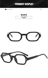 Detail of glossy black polygonal glasses frame with silver diamond rivet accents
