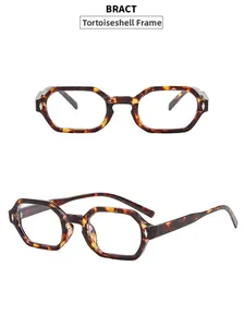 Detail view of hexagonal tortoise shell eyeglass frames with silver rivet accents