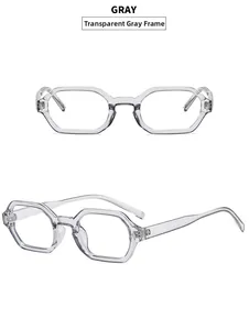 Detail view of transparent grey geometric eyeglasses frame with rivet accents