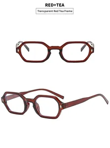 Detail view of transparent tea color hexagonal geometric glasses frame with metal rivets