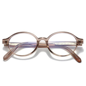 Modern oval anti-blue light glasses with transparent amber frames and textured wire core