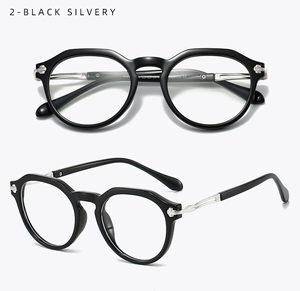 Close-up of retro TR90 black oval frame glasses with silver metal temples and detailing