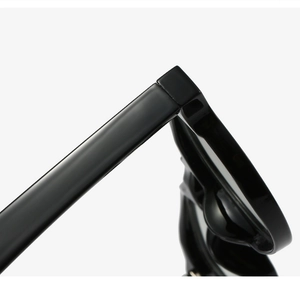 Macro view of high-gloss black TR90 frame hinge and sturdy construction of the glasses
