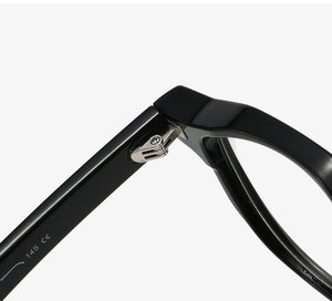 Detail of the high-quality metal hinge and CE mark on black TR90 eyewear frame