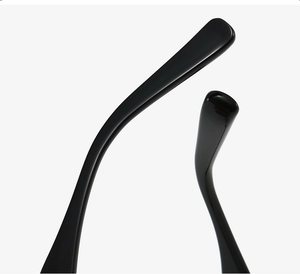 Detail shot of sleek black TR90 temple tips with a glossy finish for ultra-light eyewear