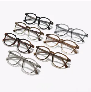Flat lay of retro TR90 eyeglasses frames in seven various colors with metal hinge detail