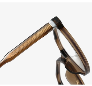 Close-up of tortoise shell TR90 frame hinge with star detail and silver metal accent