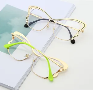 Detailed top view of butterfly-shaped metal frames with gold and neon green accents