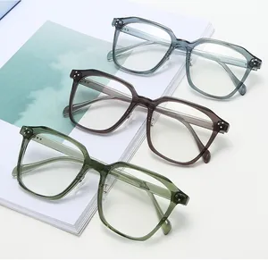 Three pairs of transparent TR90 oversized glasses frames in blue, tea, and green colors