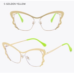 Macro detail of golden butterfly glasses frame with vibrant green temple tips