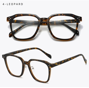 Macro detail of leopard print TR90 eyeglass frame with silver rivet studs and clear nose pads