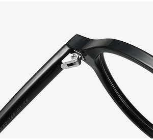 Macro view of black acetate eyewear frame with metal hinge and CE mark details