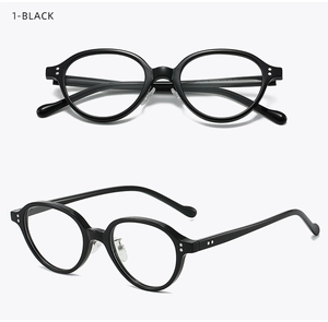 Detail view of black oval eyewear frame with silver rivet accents and transparent nose pads