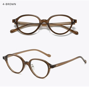 Detail view of oval retro brown glasses frame in high-quality translucent amber acetate