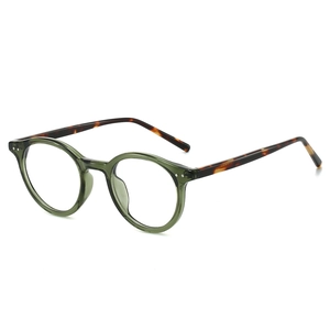 Lunettes ovales rétro vert olive avec branches en écaille et détails de rivets argentés