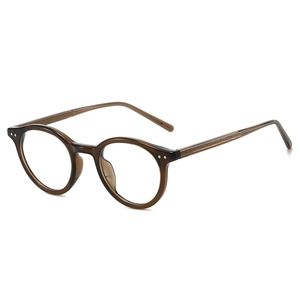 Monture de lunettes ovale rétro en écaille avec gravure métallique sur les branches
