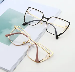 Detail of vintage cat-eye metal glasses frames on a magazine with blue accent