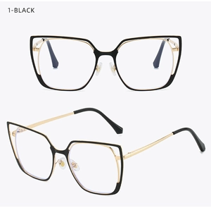 Detail view of black and gold cat-eye glasses frames with blue light blocking lenses