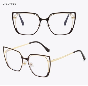 Detail view of cat-eye glasses frame with coffee and gold color blocking design