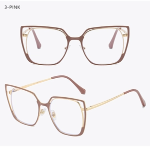 Detail of pink cat eye glasses frames with gold metal temples and adjustable nose pads