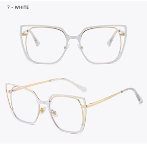 Detail of white cat eye glasses frame with gold metal accents and modern bicolor design