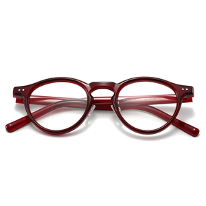 Retro deep red transparent TR90 round frame eyeglasses with silver stud accents
