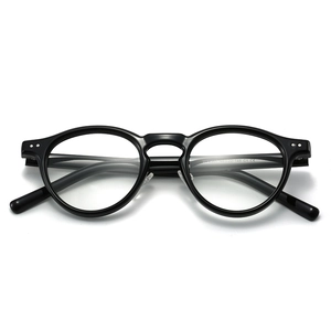 Classic retro round TR90 eyeglasses frame in black with double dot metallic accents