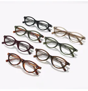 Top view of retro oval glasses frames in multiple colors with metallic rivet accents