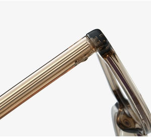 Macro shot of durable metal hinge and translucent frame structure of cat-eye glasses