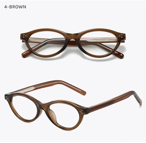 Detail view of brown transparent oval eyeglass frames with metallic hinge accents